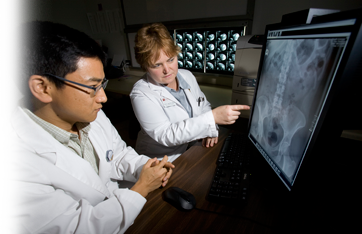 Photo of interns reviewing image