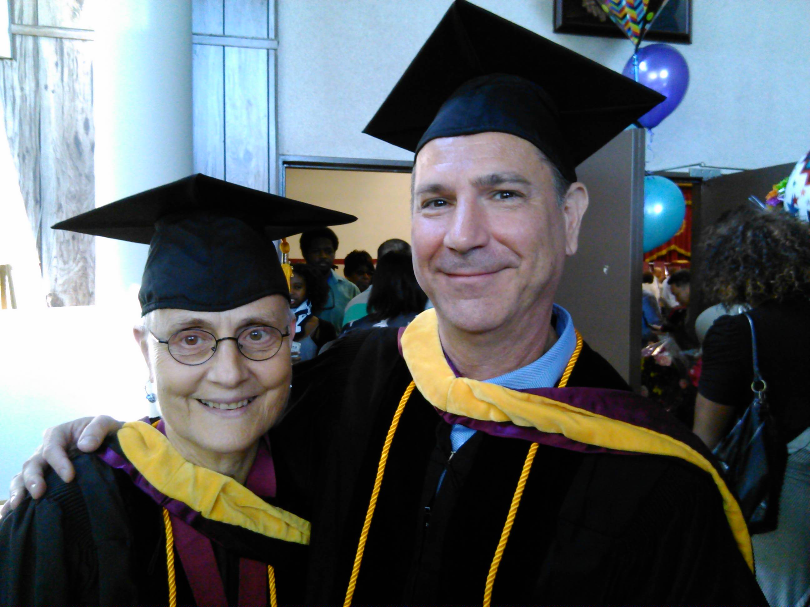 MSOM graduates Linda Oster and Robert Fischer at Commencement