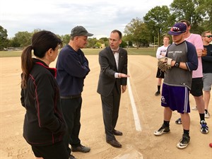 President Joseph Stiefel, MS, EdD, DC speaking to faculty and students at softball competition