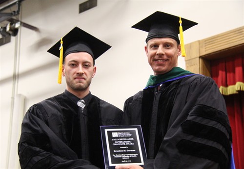 Dr. Daniel Strauss presents Joseph Janse Outstanding Graduate Award to DC graduate Brandon Michael German