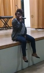 student singing at talent show