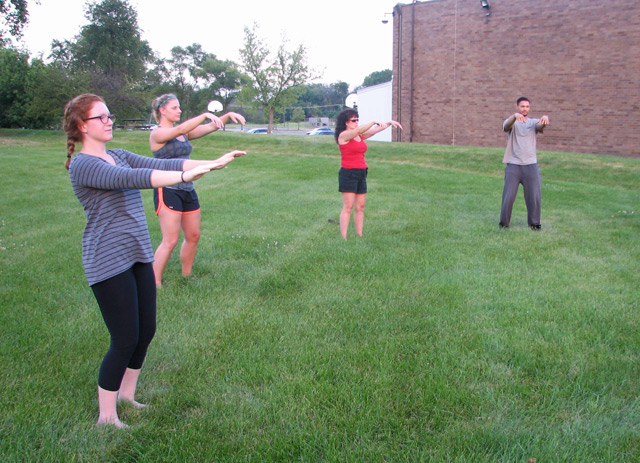 aom students practice qi gong outside