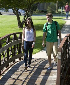nuhs students walk on campus in summer