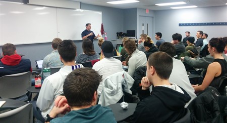 Stuart Yoss, DC, CCSP, ART, the official team chiropractor for the Chicago Bulls and Blackhawks speaking to students