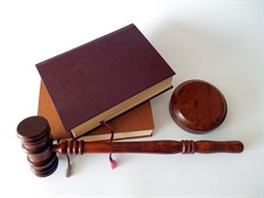 law books on table with gavel