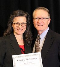Claire Johnson, DC, PhD, and Bart Green, DC, PhD, holding the Robert C. Reed Award
