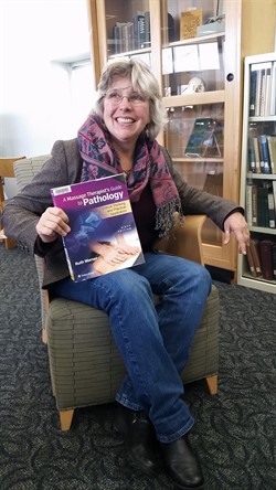 Ruth Werner holding text book