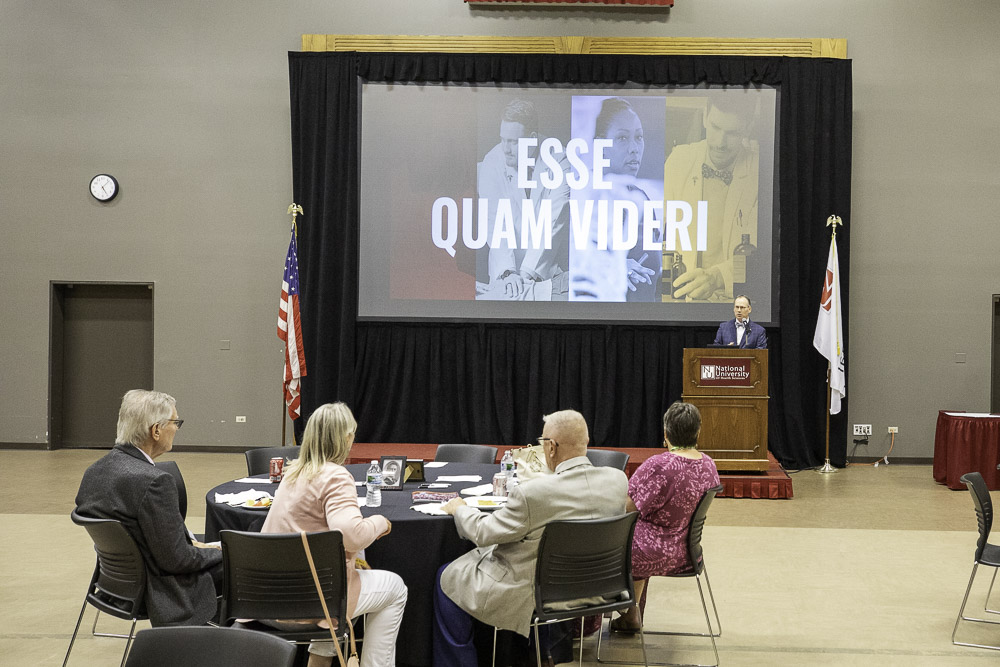 Alumni listen to the President's speech