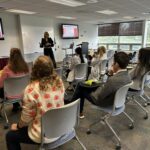Ashley Henderickson presents GI health room full of NUHS students