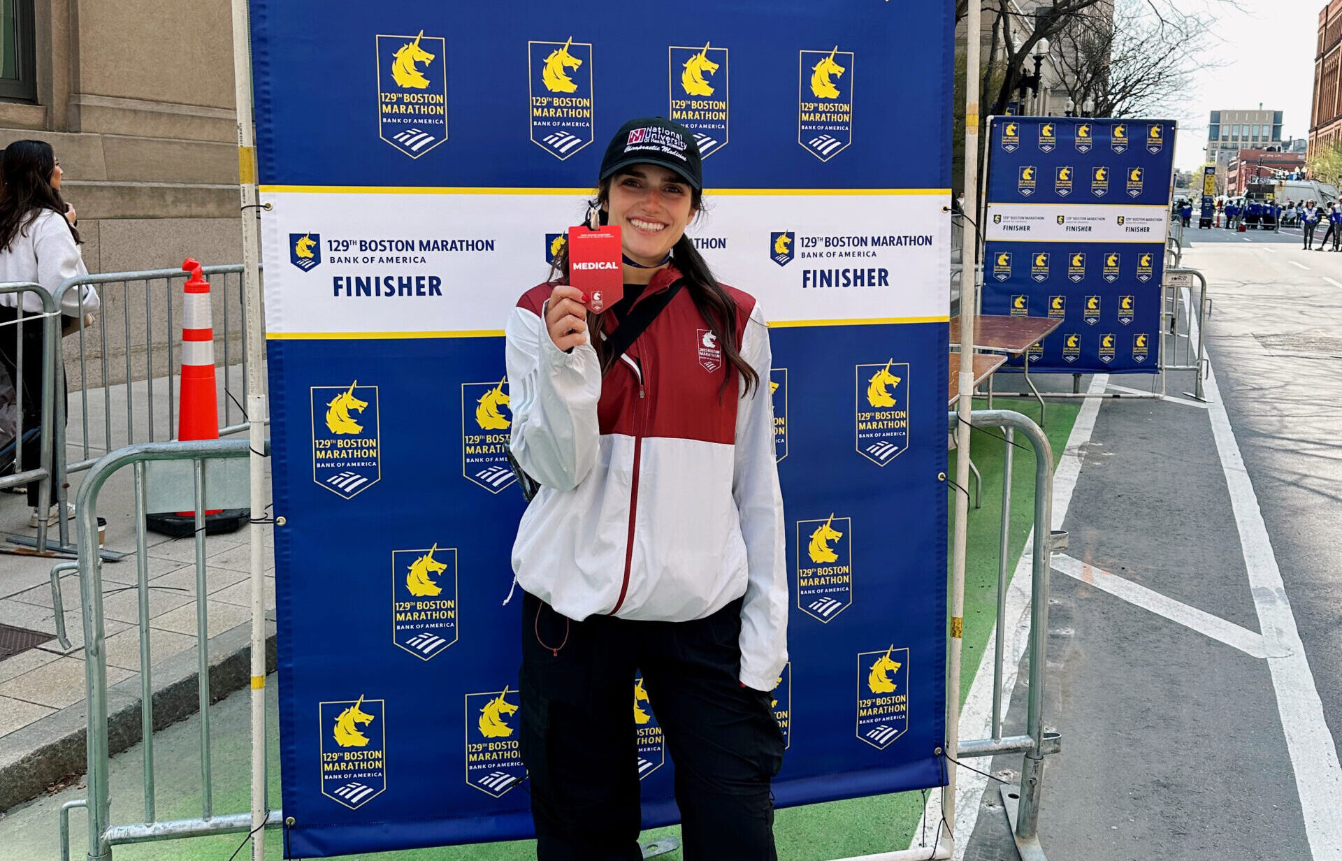 Liza poses with medical badge