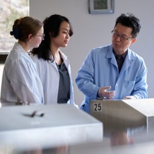 Dr. Kim working with students in the cadaver lab
