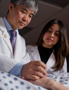Dr Kwon instructs an intern
