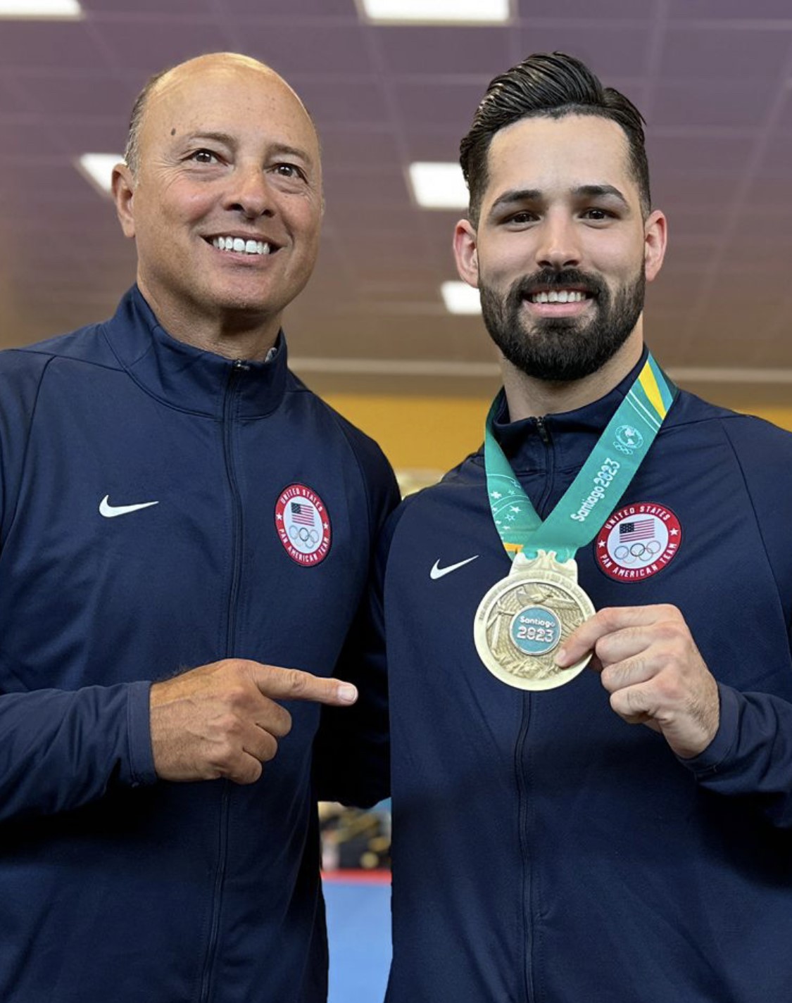 Carlo Guadagno, DC, DACBSP®, ICSC, FICC, a National University of Health Sciences’ Florida faculty member, poses with Gold medalist Ariel Torres Karate.