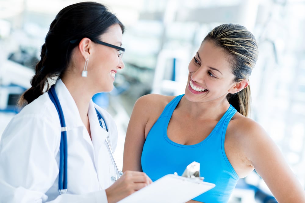 Female doctor at the gym with a patient