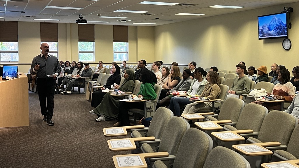 Dr. Garofalo presents to a room full of students