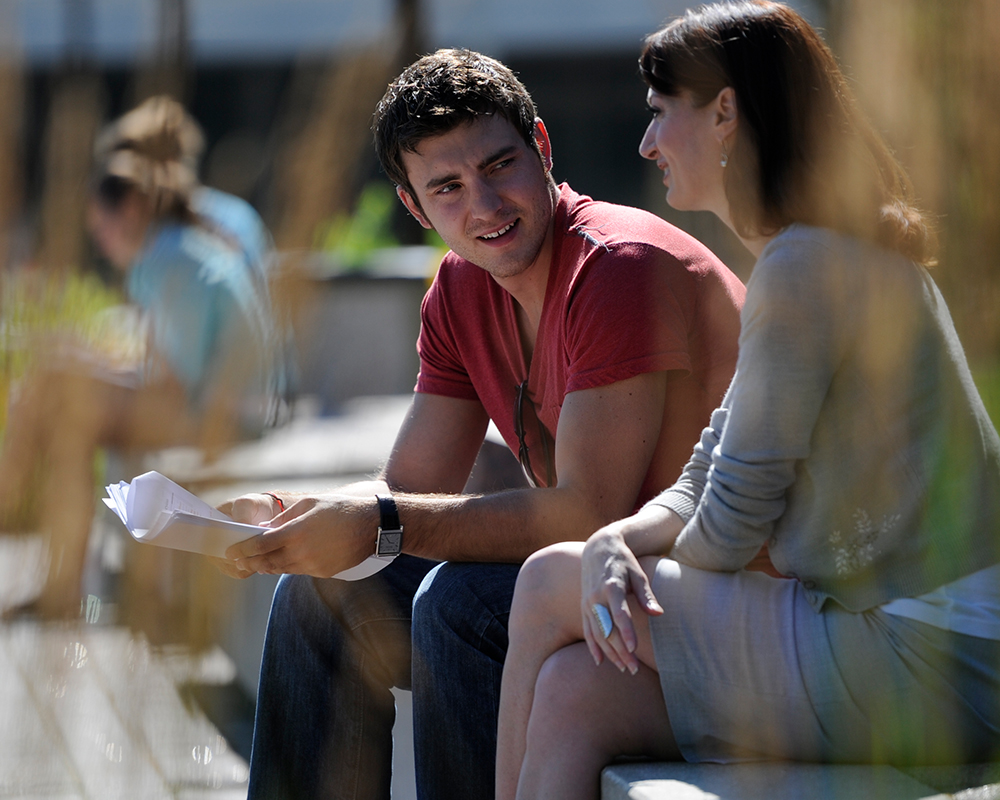 students sitting outside at NUHS campus