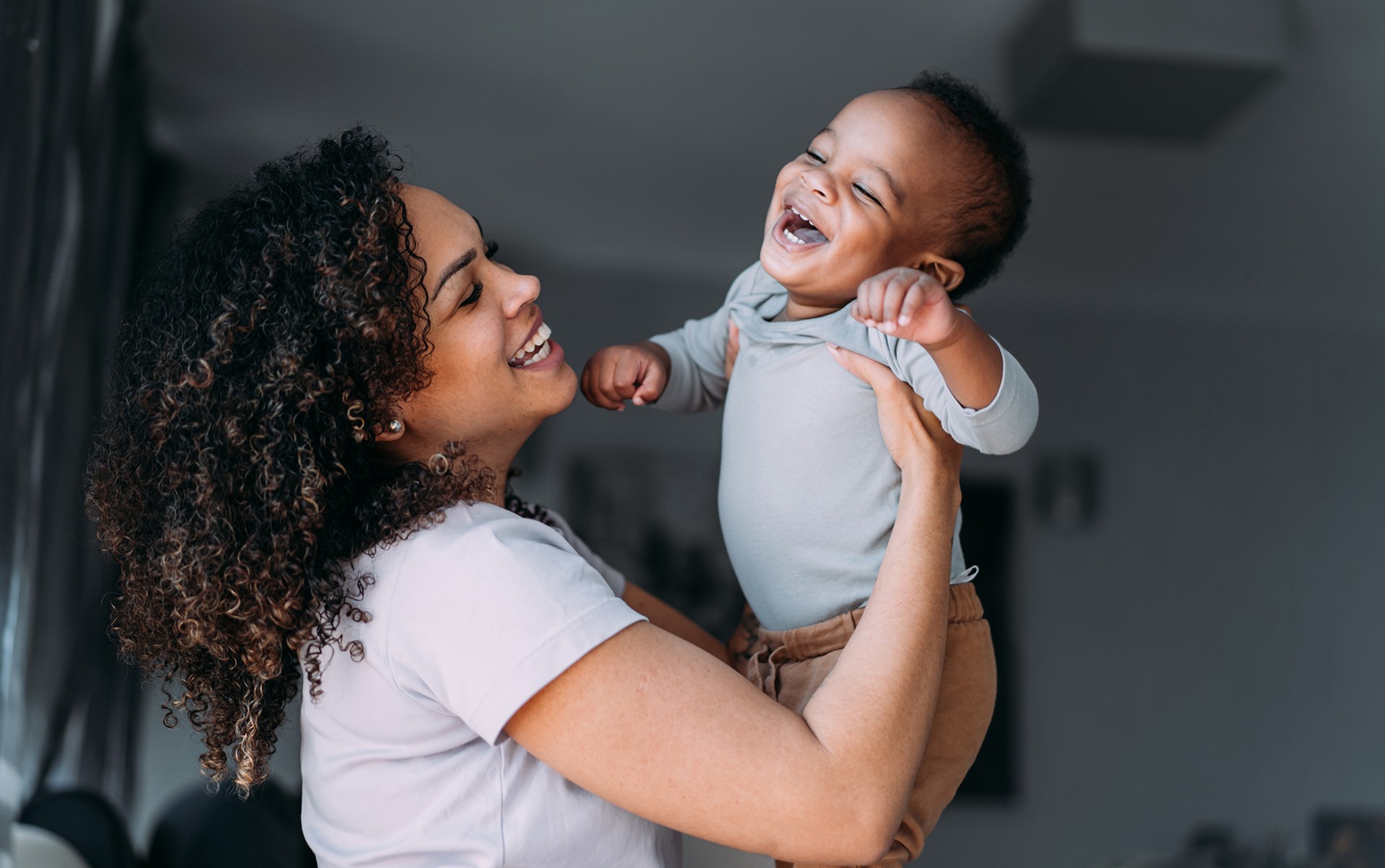 Smiling mother and infant