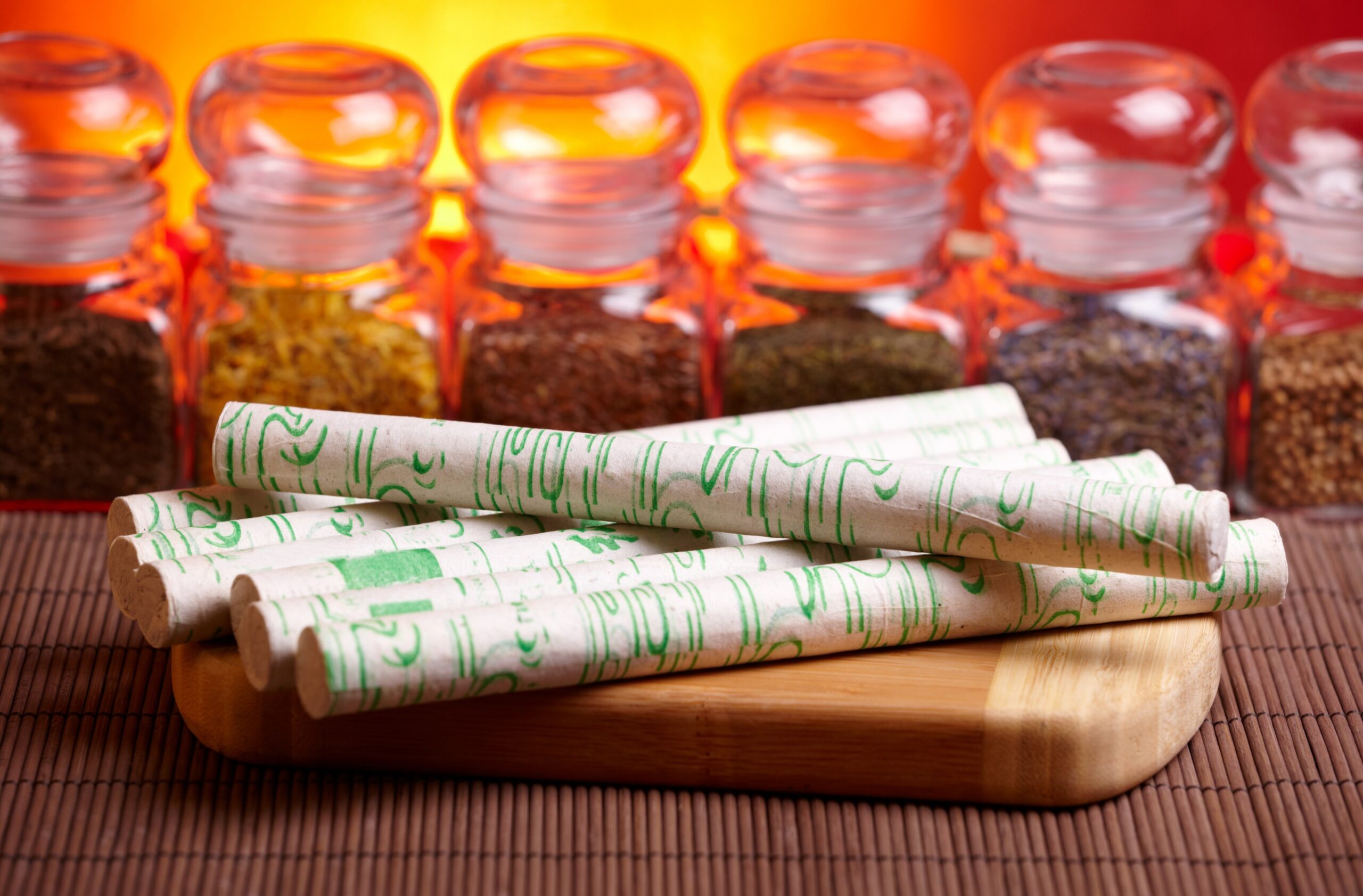 TCM Moxibustion sticks with Chinese herbs in background