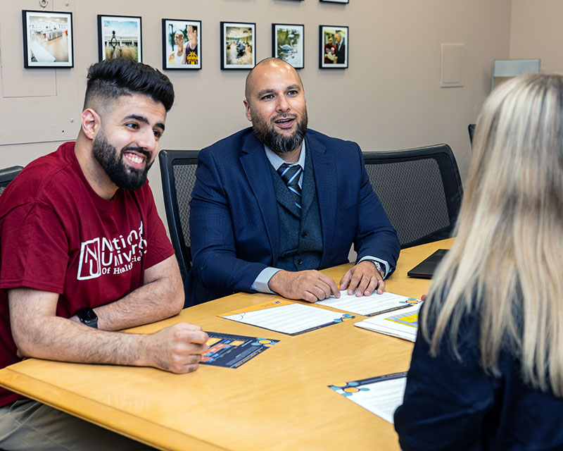 admissions staff working with student