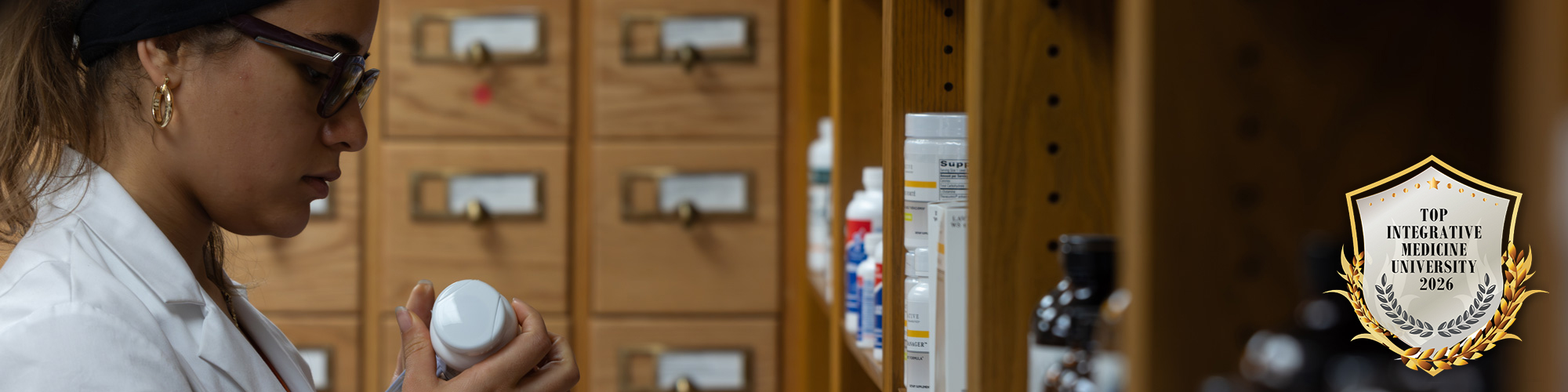 NUHS Naturopathic student working in dispensary